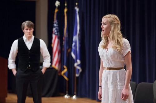 Students perform on stage